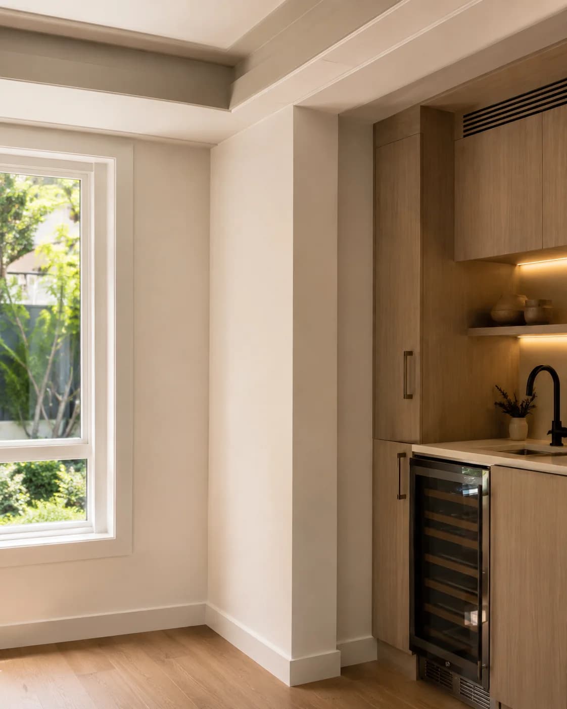 Freshly painted interior wall next to a built-in wet bar
