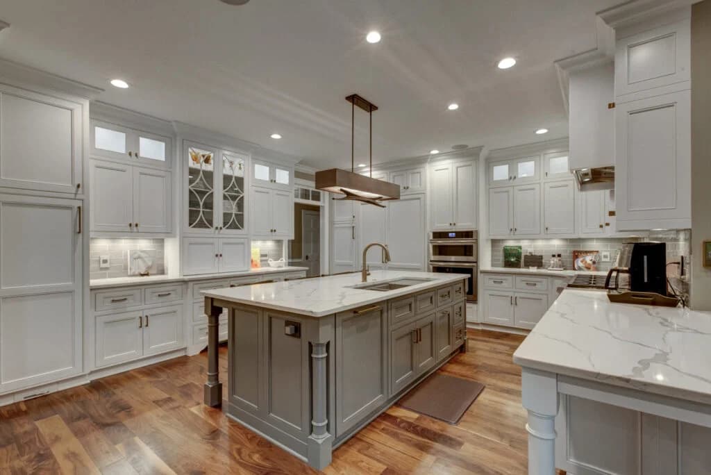Dark shaker cabinetry with granite countertops, a tile backsplash and a built-in wine rack