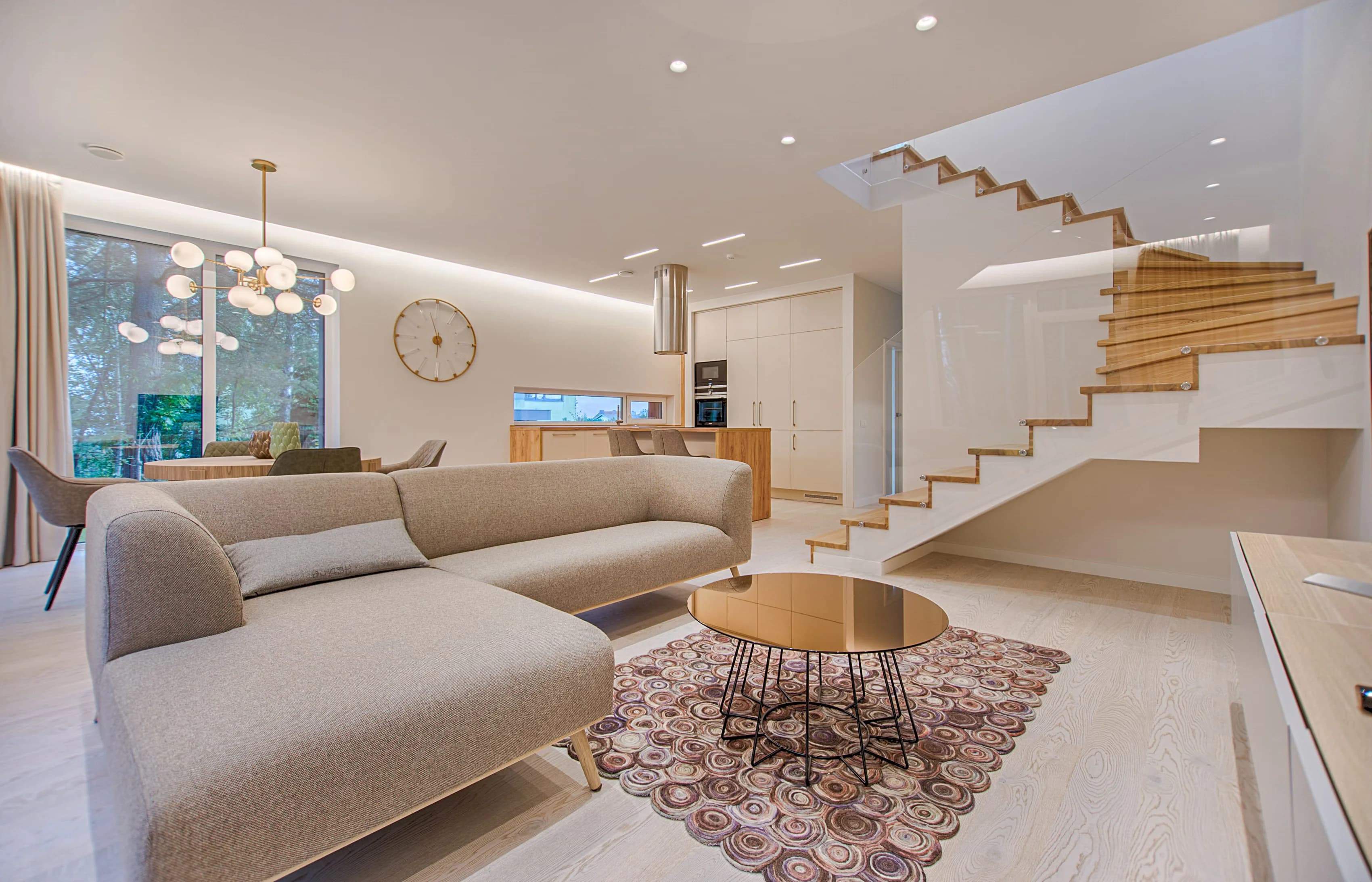 Remodeled kitchen with a quartz peninsula, shaker cabinets and pendant lighting, completed by JJK Construction